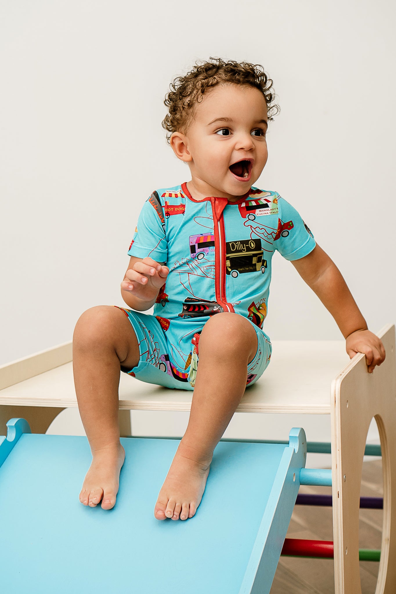 a boy with a surprised look on his face and wearing Foodie Fun print Bamboo Zppy