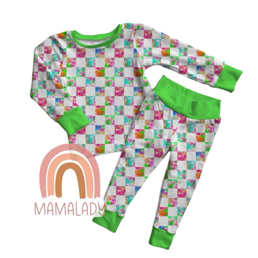 our neon checkers print bamboo two piece pajama set laying on a white background with our mamalady logo in the corner
