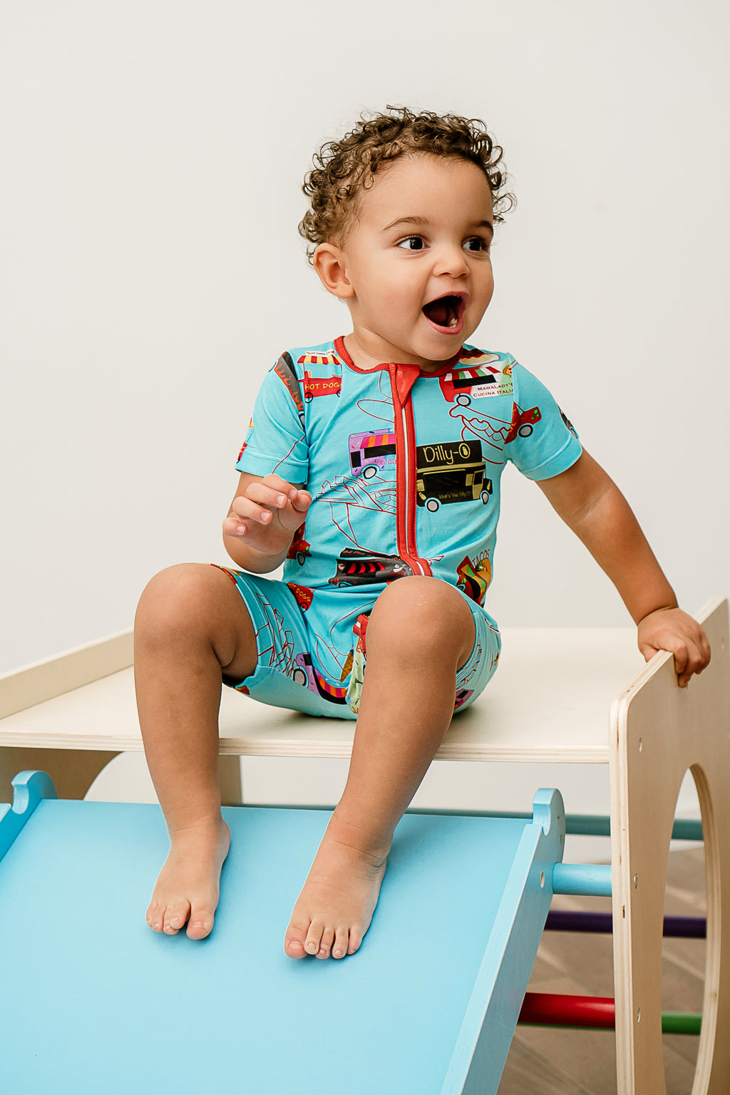 a boy with a surprised look on his face and wearing Foodie Fun print Bamboo Zppy