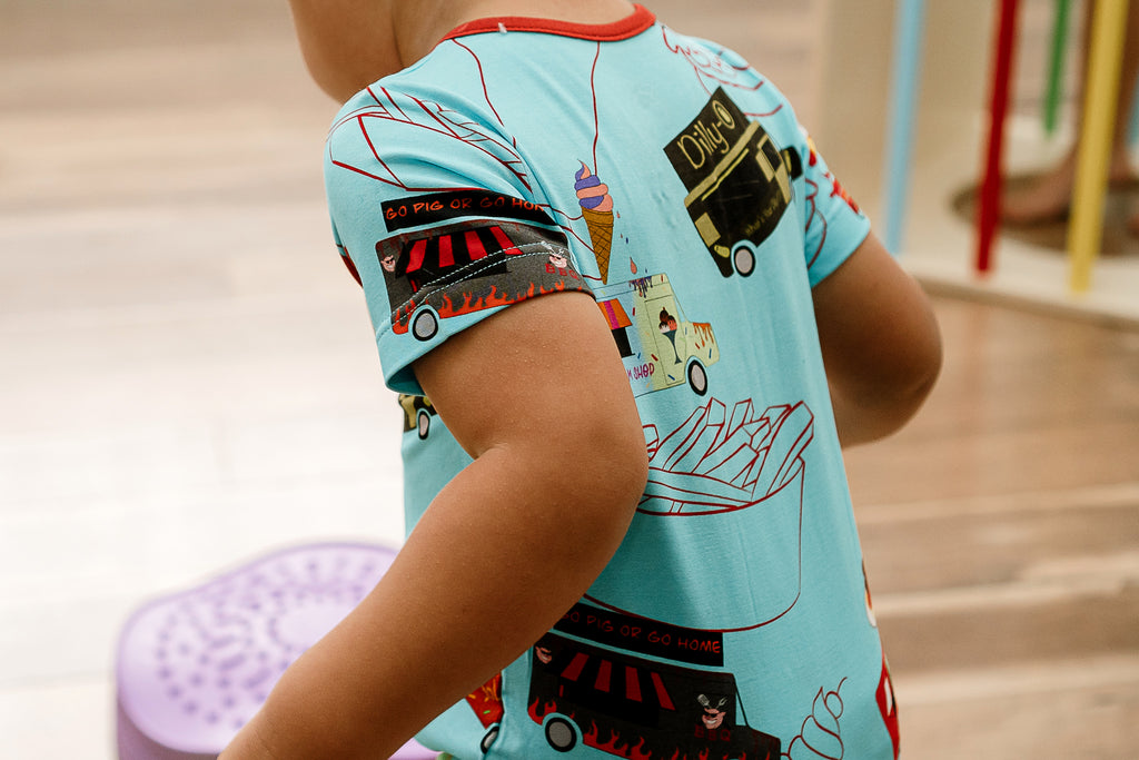the back of a child wearing Foodie Fun bamboo short sleeved romper