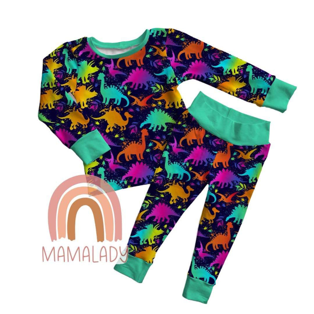 our neon dinosaurs print two piece pajamas laying on a white background with our mamalady logo in the corner