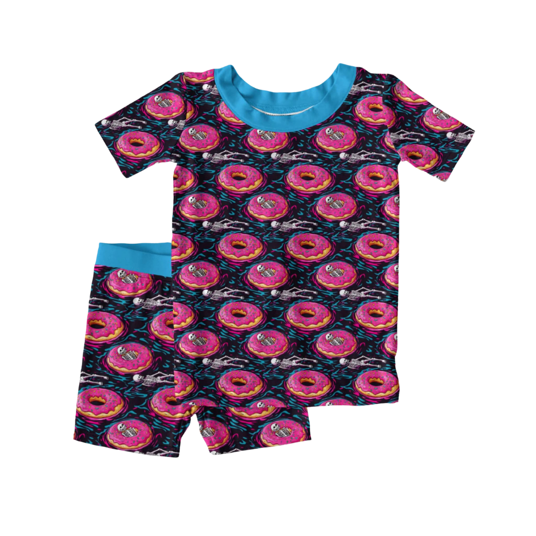 Ghoulish Glaze Halloween bamboo two piece pajamas with pink donuts skeletons and spooky treats
